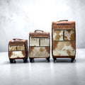 Tan tooled leather & cowhide luggage 